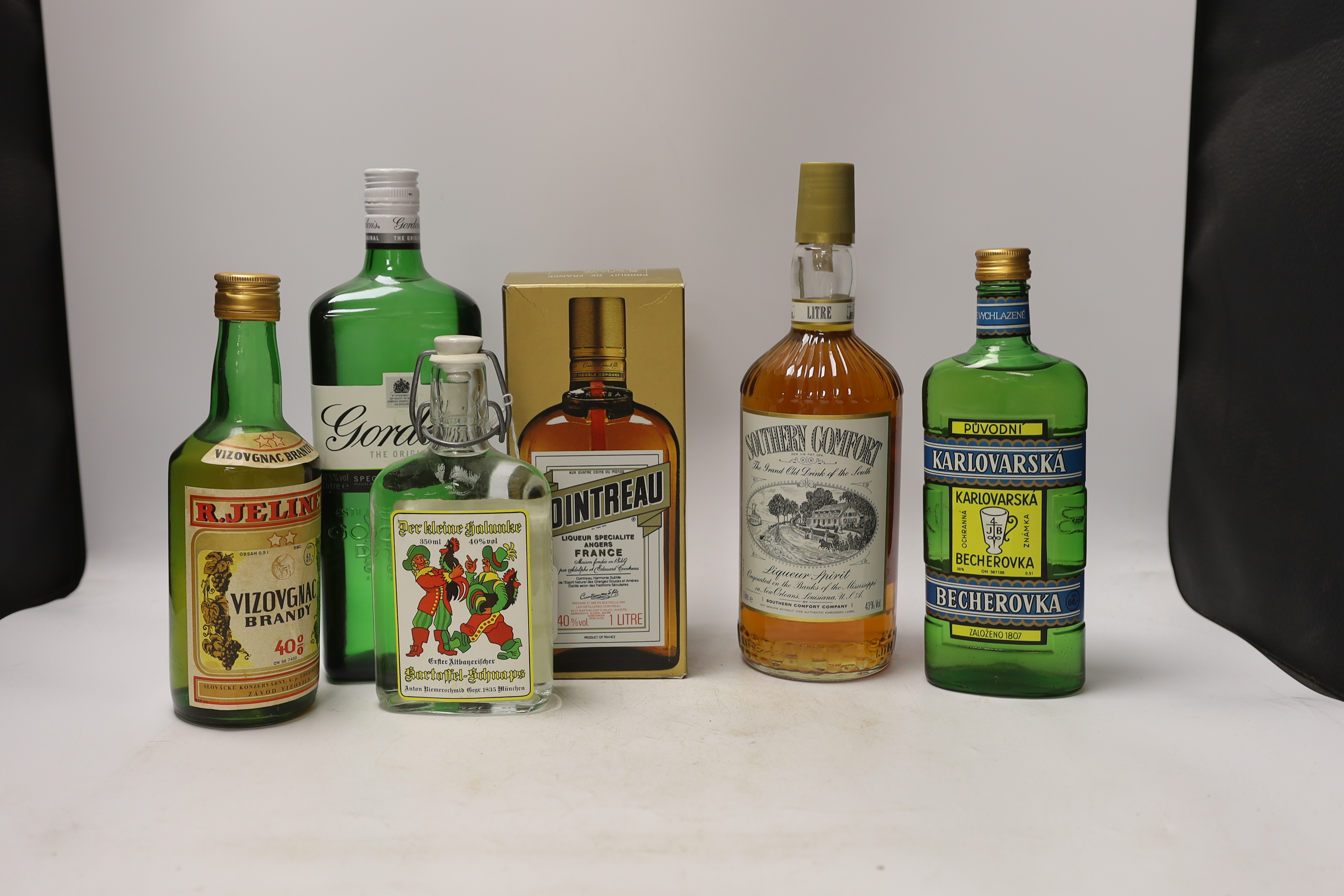 Ten various bottles of spirits and liqueurs, Gordon’s gin, Southern Comfort, Cointreau etc